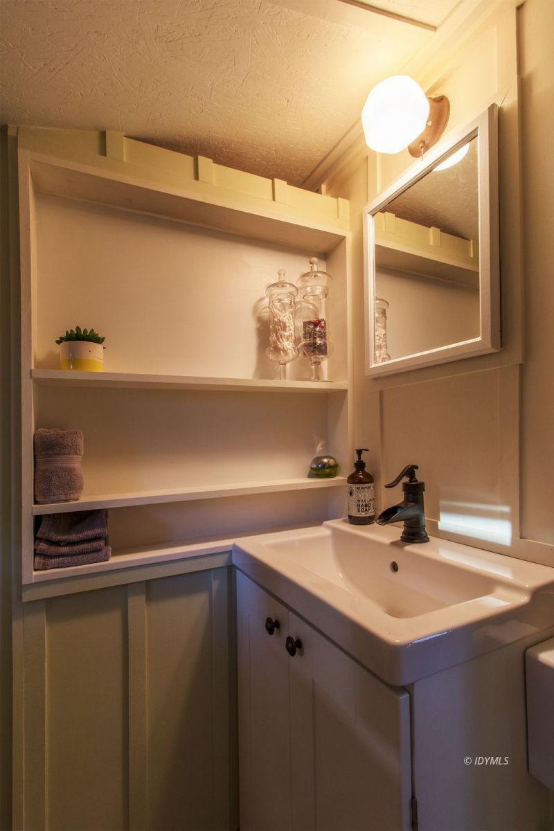 52830 Cedar Crest Drive Pine Cove, CA 92549 - Photo 22 of 31 a bathroom with a sink and a mirror