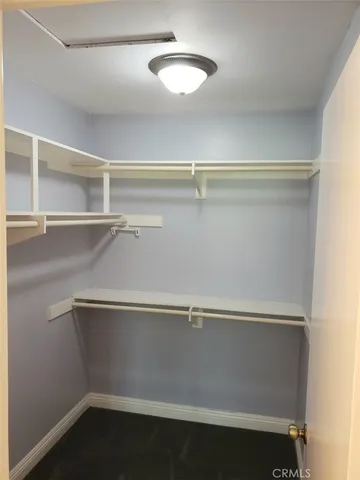 a bathroom with a sink a toilet a mirror a bathtub and shower