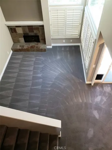 a kitchen with stainless steel appliances granite countertop a sink and a refrigerator