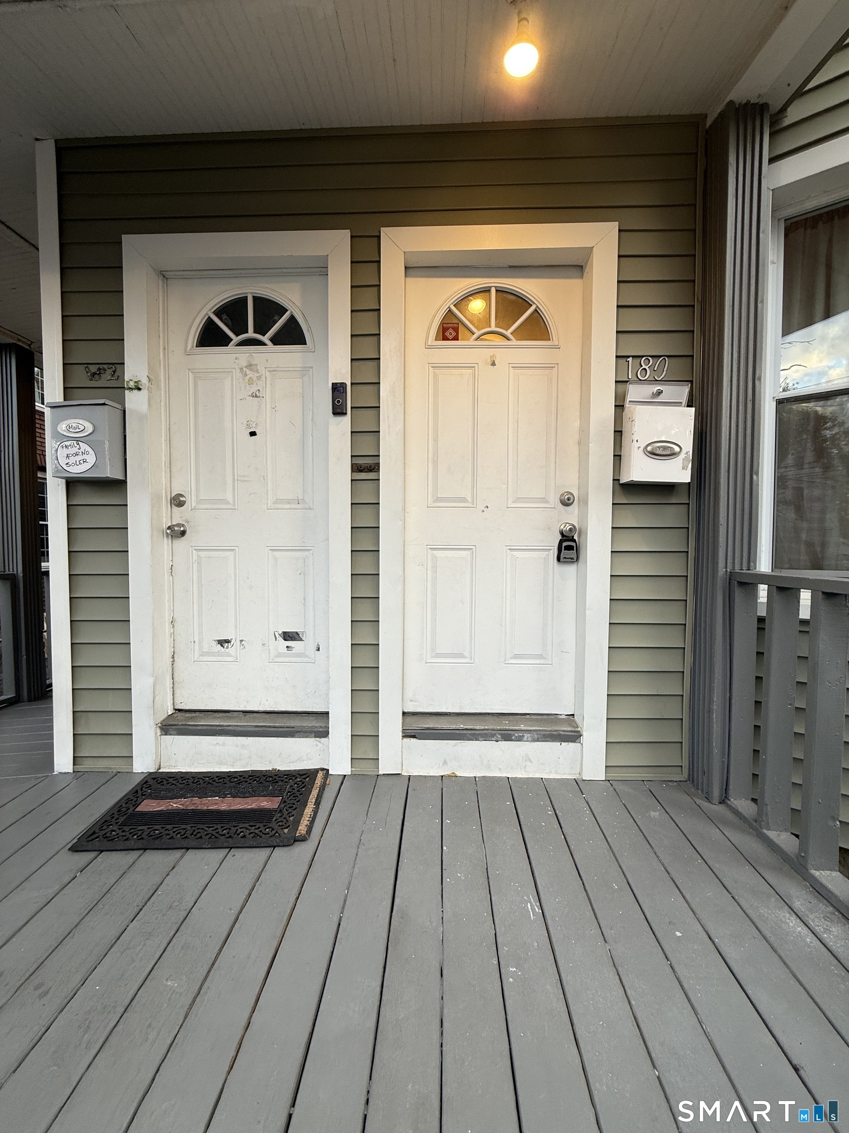 180 5th Street, Unit 1 Bridgeport, CT 06607 - Photo 1 of 26 a view of a door house with wooden floor