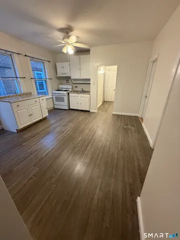 a view of a kitchen from the hallway