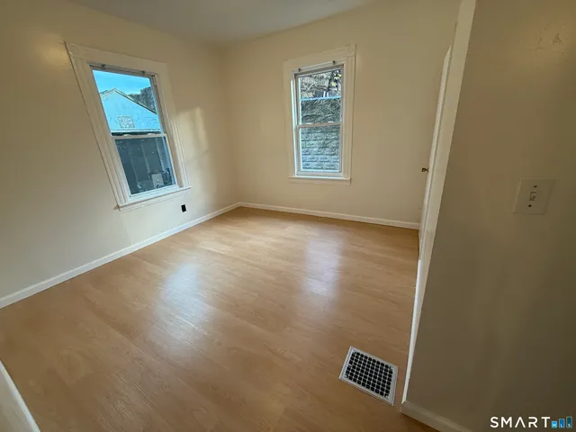 an empty room with windows