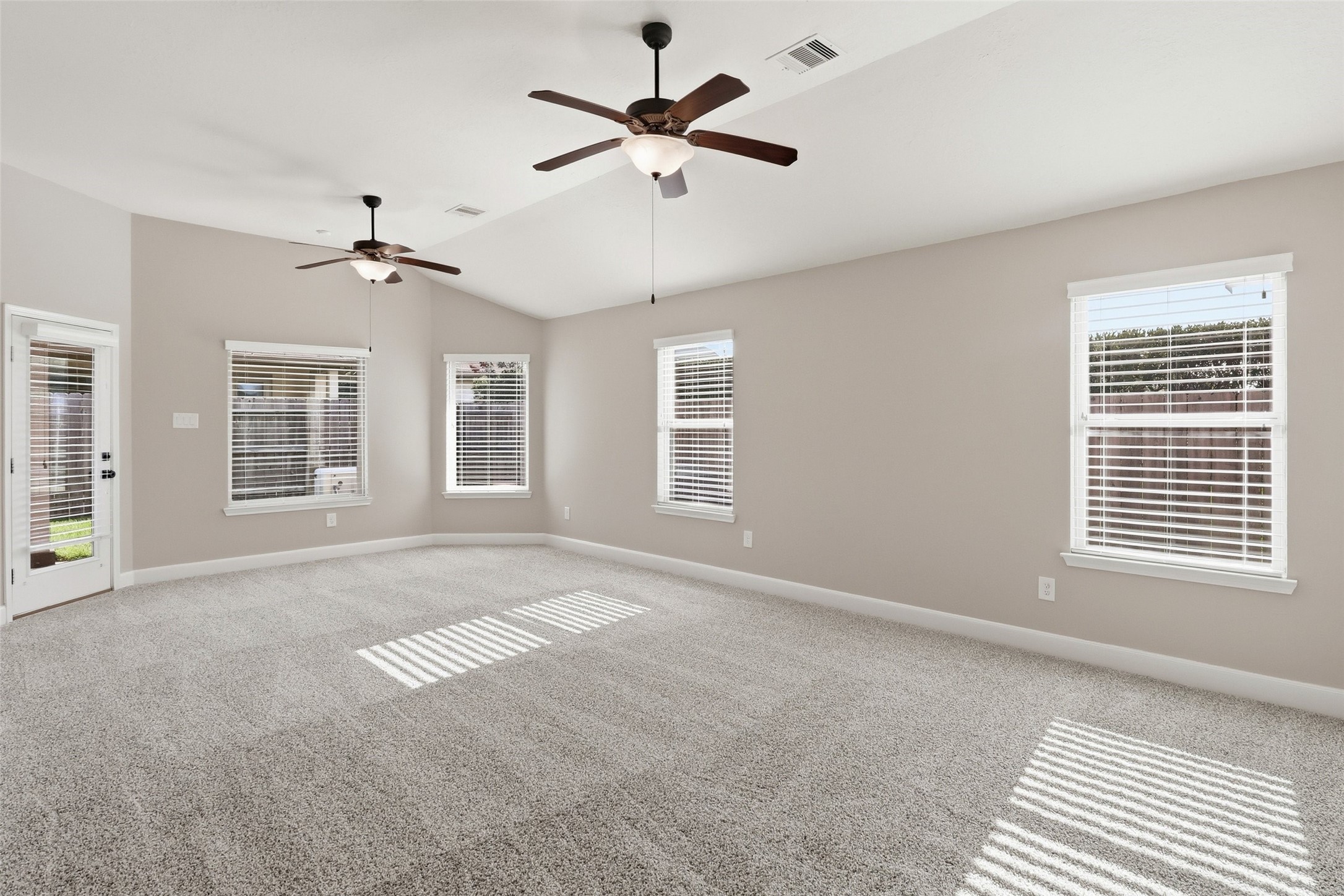 24126 Cane Fields Road Katy, TX 77493 - Photo 24 of 36 Spacious primary suite filled with natural light from expansive windows