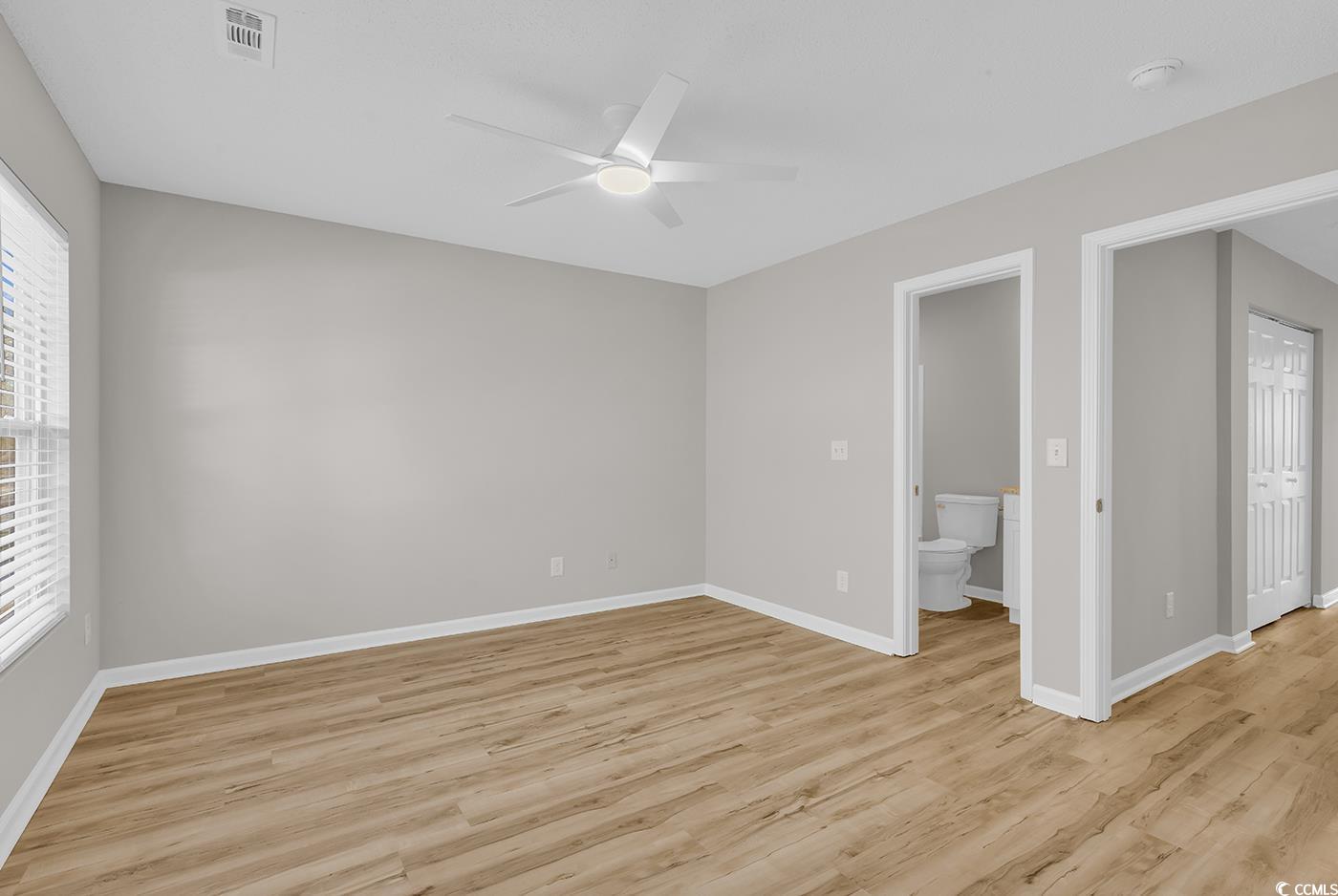 308 Kiskadee Loop, Unit E Conway, SC 29526 - Photo 24 of 36 Unfurnished room with light wood-type flooring and ceiling fan
