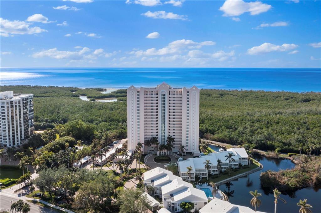 6101 Pelican Bay Boulevard, Unit 1404 Naples, FL 34108 - Photo 4 of 22 a view of lake with mountain view