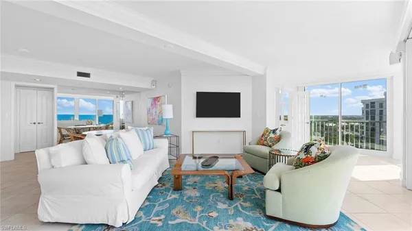 a living room with furniture and a flat screen tv