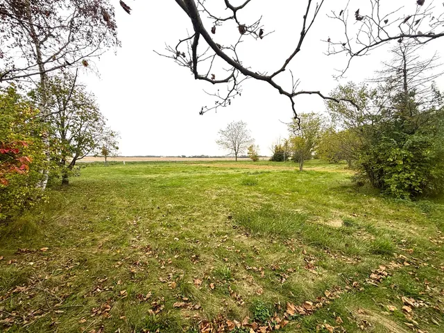 a view of a field with an outdoor space