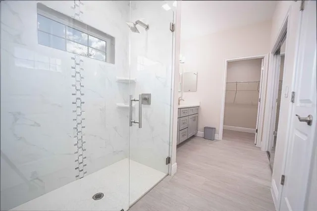 a bathroom with a bathtub and a shower