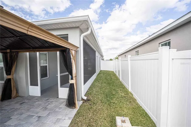 a view of a back yard of the house