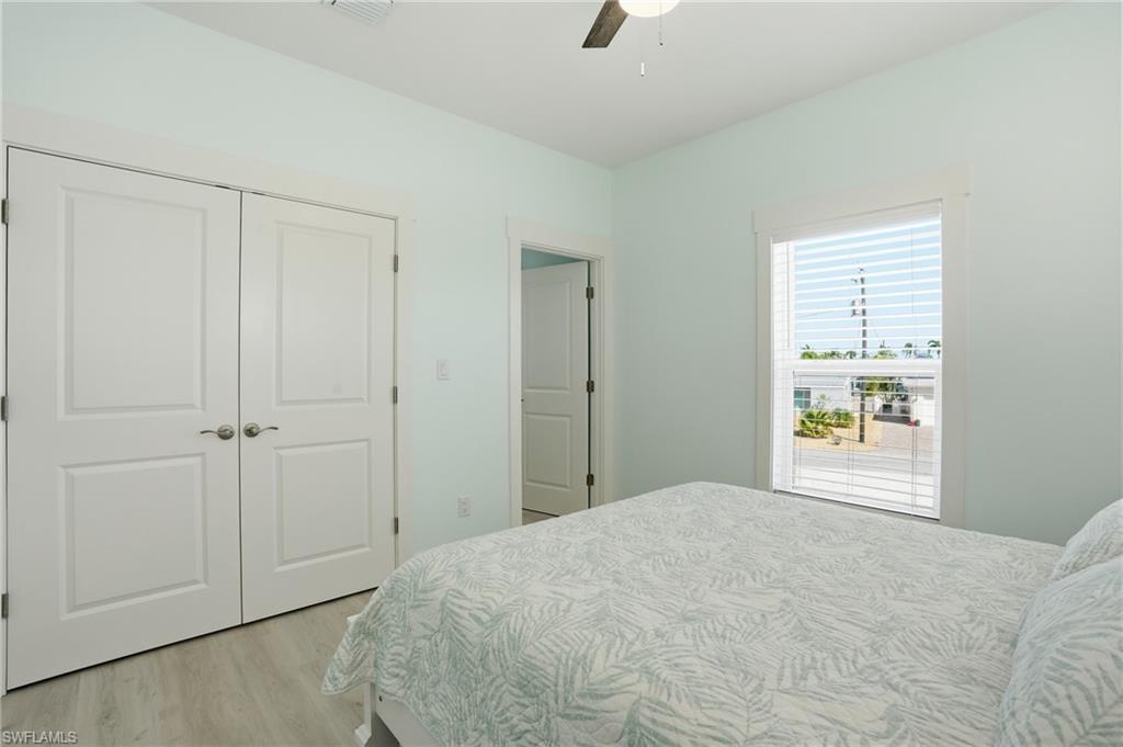 1 Fairview Boulevard Fort Myers Beach, FL 33931 - Photo 15 of 48 a bedroom with a bed and a window