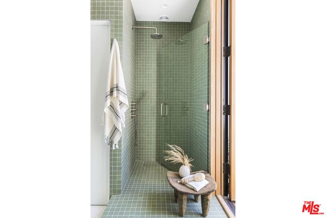 a bathroom with a toilet and a shower curtain
