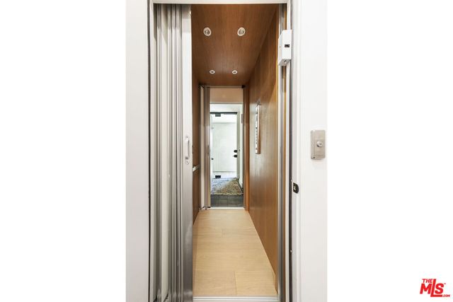 a view of a hallway with floor to ceiling window