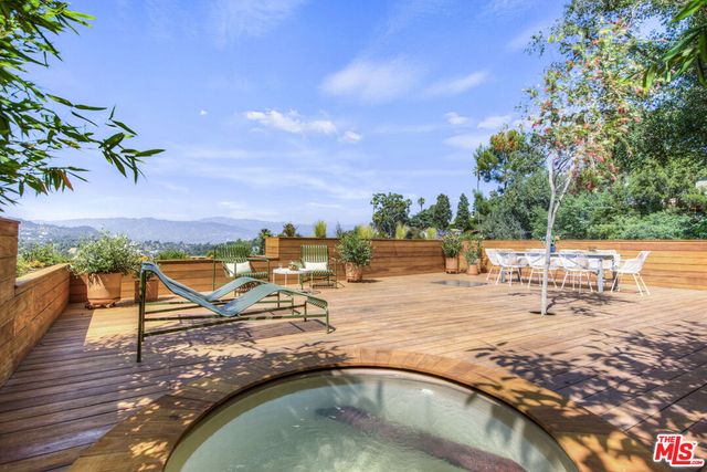 a view of a swimming pool with a lounge chair