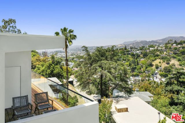 a view of balcony with a potted plant