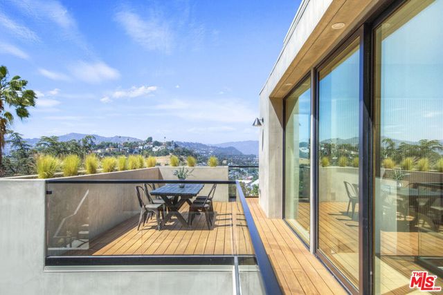 a view of swimming pool with a lounge chair