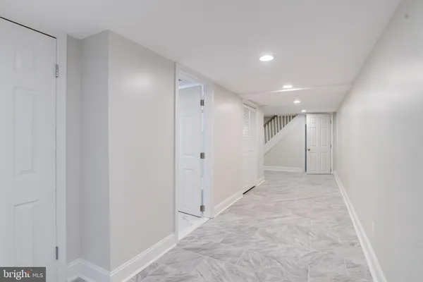 a view of an empty room and a window