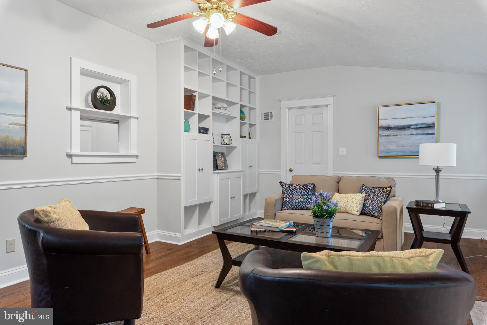 9 Dogwood Road Annapolis, MD 21403 - Photo 12 of 42 a living room with furniture and a chandelier