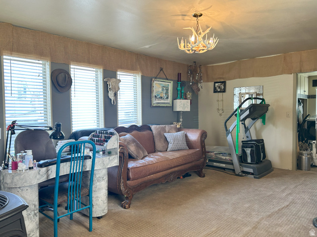 40 South State Street Scipio, UT 84656 - Photo 21 of 39 Carpeted living room featuring a chandelier
