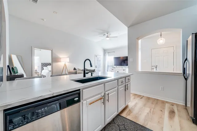 a kitchen with a sink and cabinets