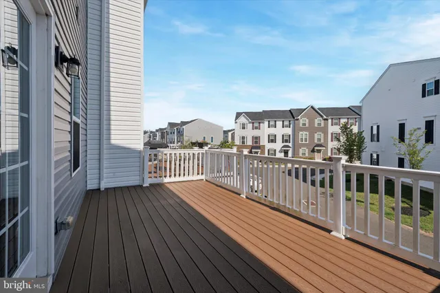 a view of a balcony with wooden floor