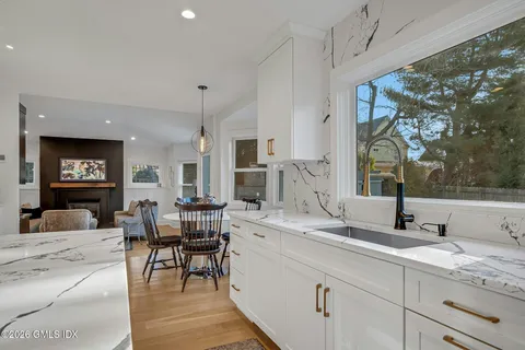 a view of a dining room with furniture window and outside view