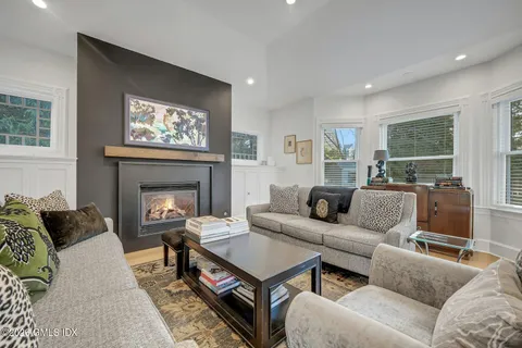 a living room with furniture and a table