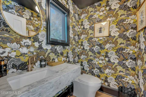 a view of entryway with wooden floor and stairs