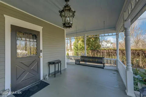 a living room with furniture and a garden