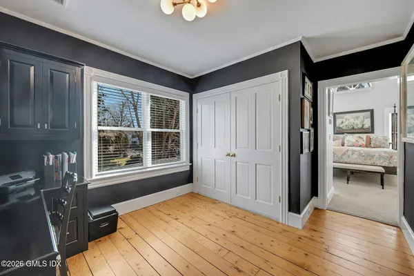 a bedroom with bed and a window