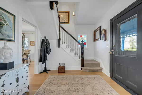 a living room with furniture and a large mirror
