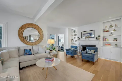 a living room with furniture and a window