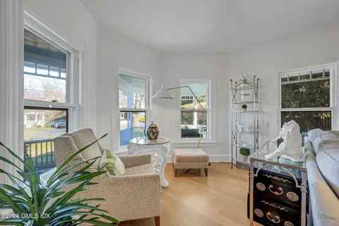 a view of a dining room with furniture window and wooden floor