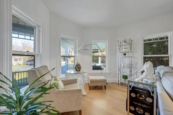 a view of a dining room with furniture window and wooden floor
