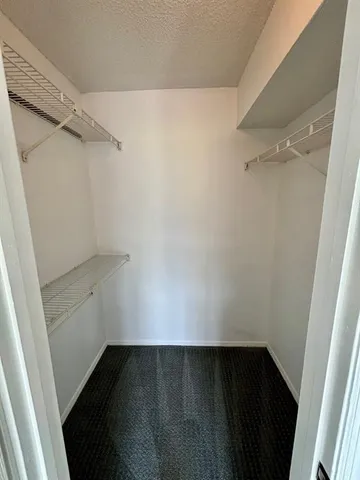 a view of an empty walk in closet