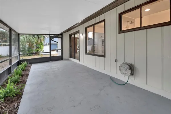 a view of an empty room with windows