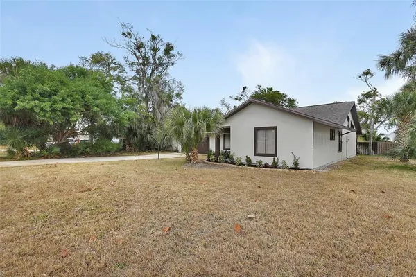 a house with trees in the background