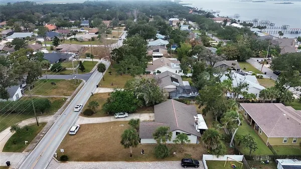an aerial view of house with yard