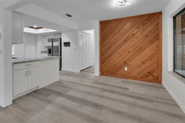 a view of a kitchen with a sink and cabinets