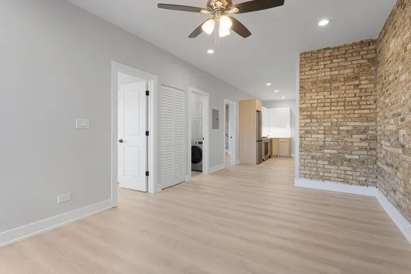 a view of an empty room with a bathroom