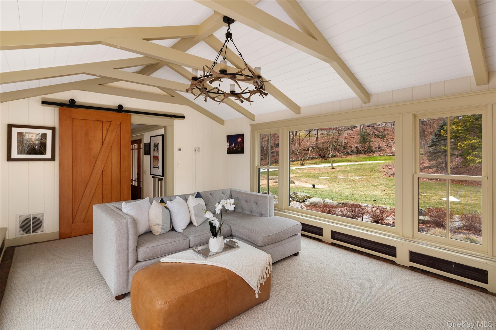 1355 Journeys End Road Croton-on-Hudson, NY 10520 - Photo 11 of 47 a living room with furniture and a large window