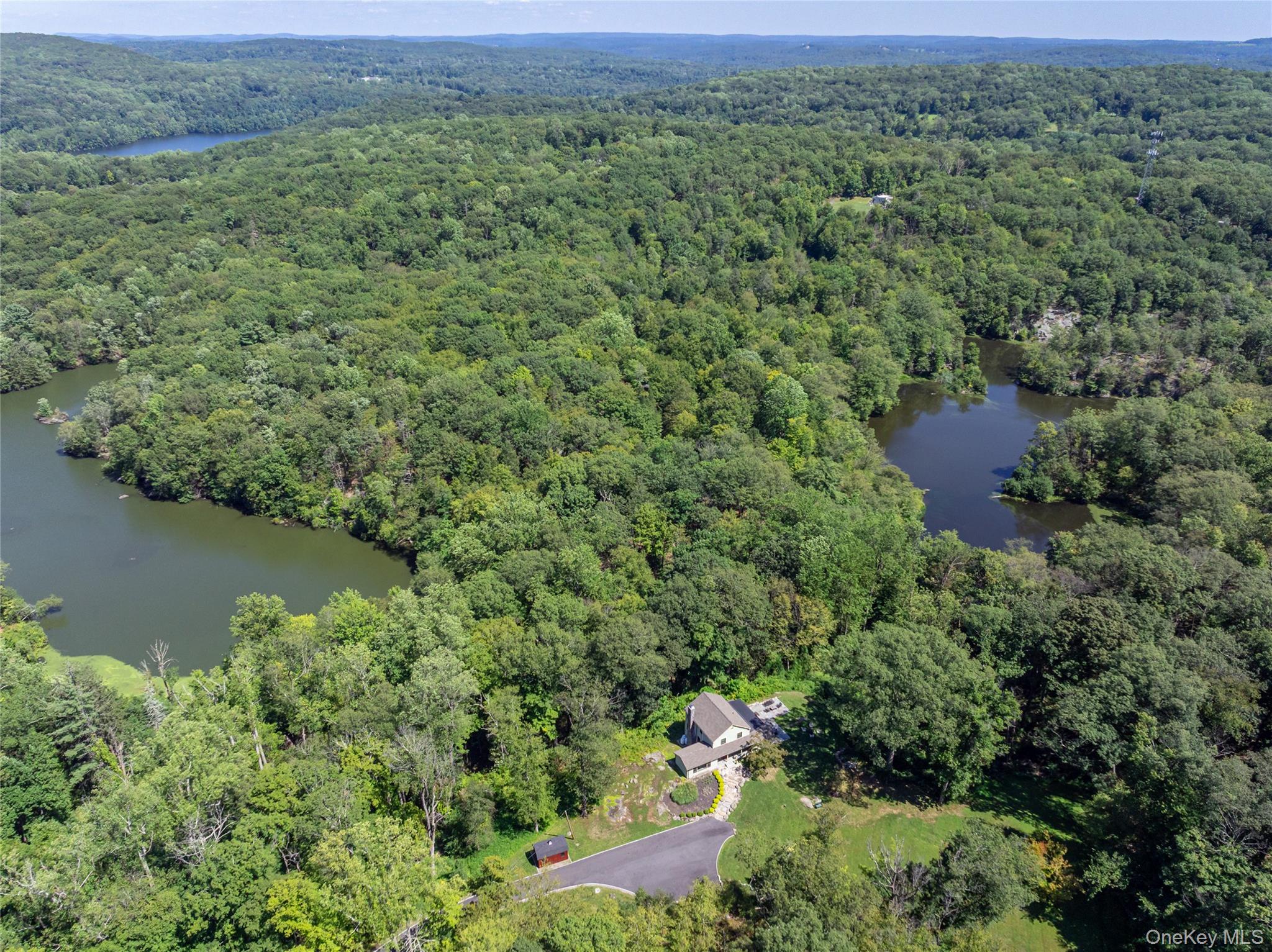 1355 Journeys End Road Croton-on-Hudson, NY 10520 - Photo 3 of 47 an aerial view of a house with a yard and lake view