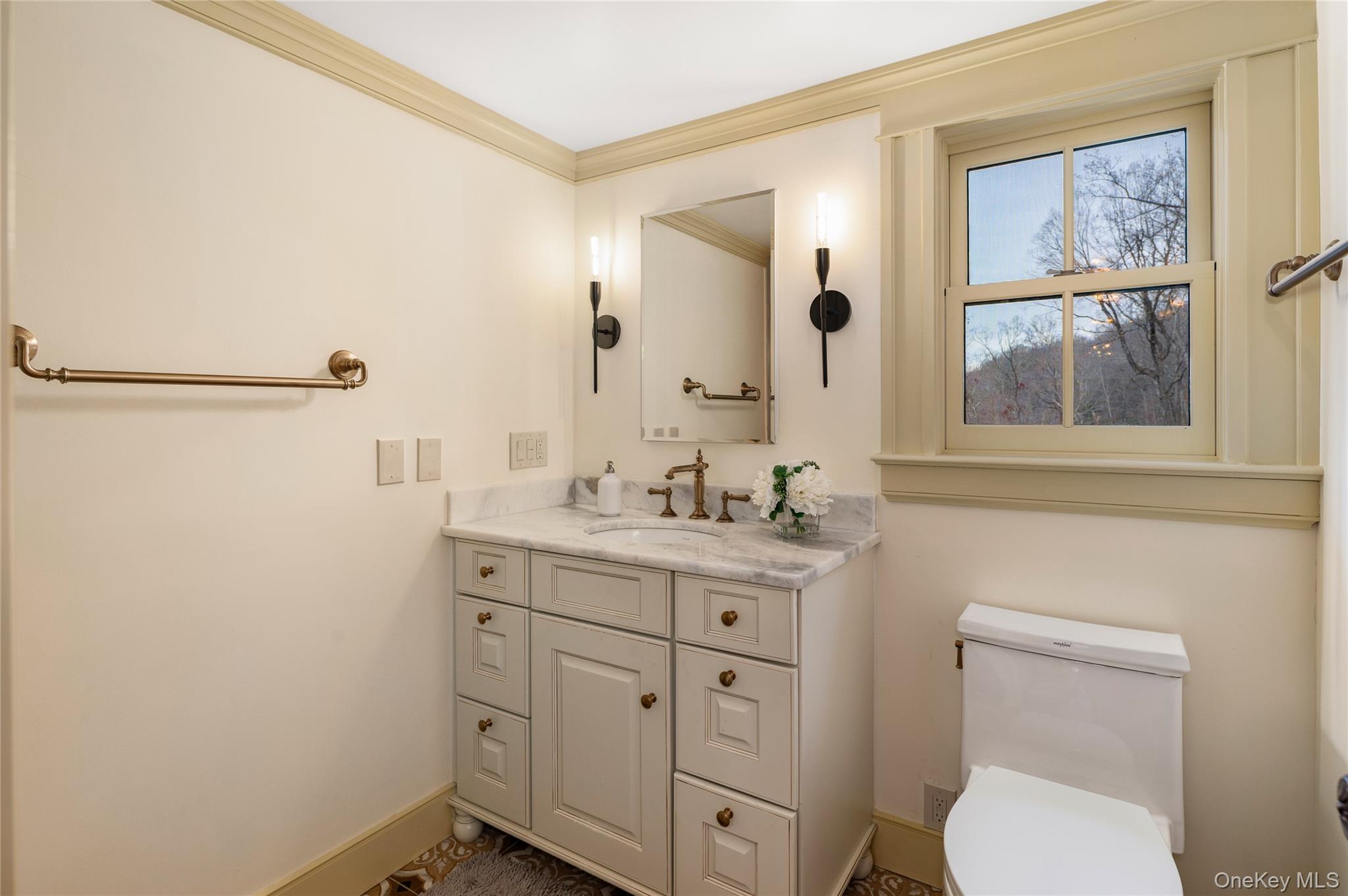 1355 Journeys End Road Croton-on-Hudson, NY 10520 - Photo 31 of 47 a spacious bathroom with a toilet sink and mirror