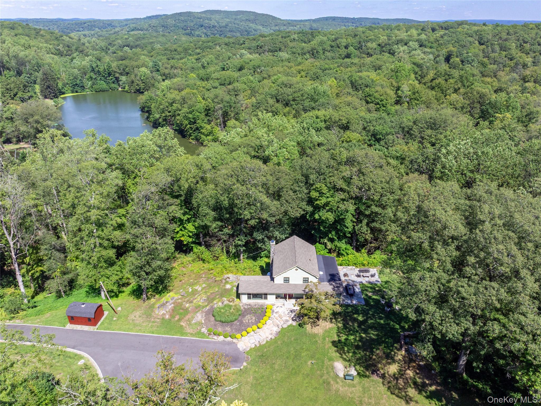 1355 Journeys End Road Croton-on-Hudson, NY 10520 - Photo 45 of 47 a view of a wooden house with a yard