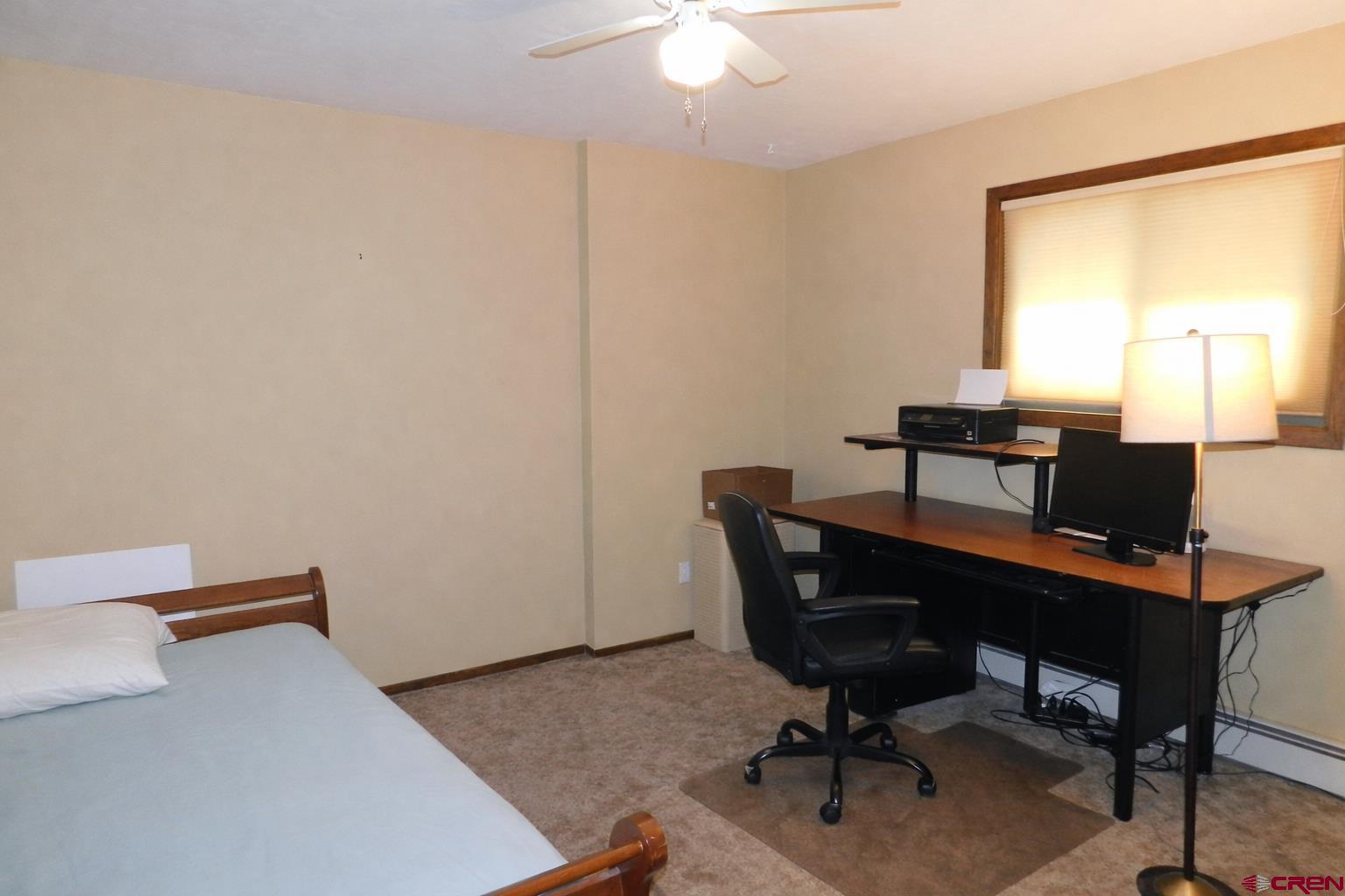 19825 Rd P Cortez, CO 81321 - Photo 11 of 38 a view of a workspace with furniture