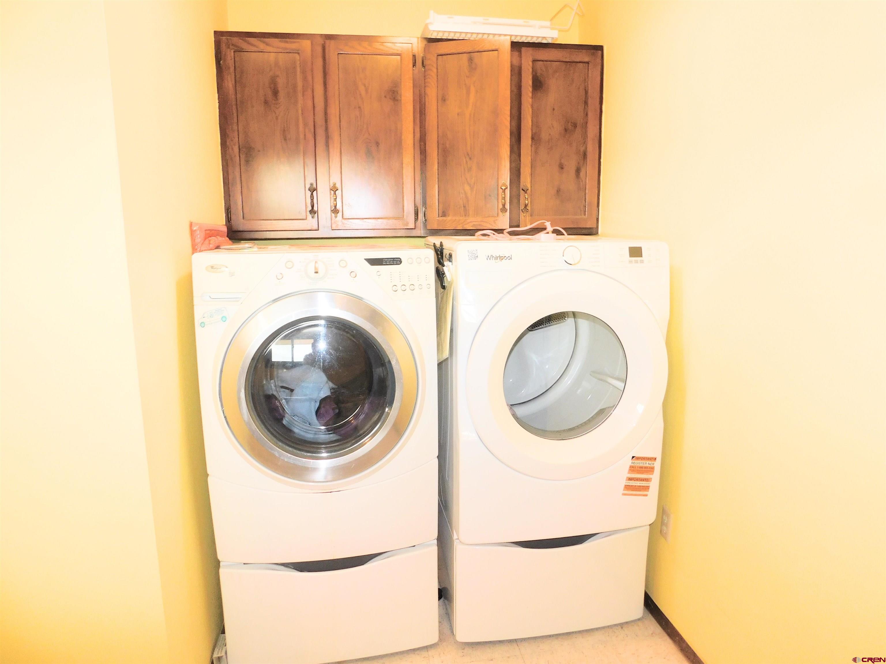 19825 Rd P Cortez, CO 81321 - Photo 14 of 38 a utility room with dryer and washer