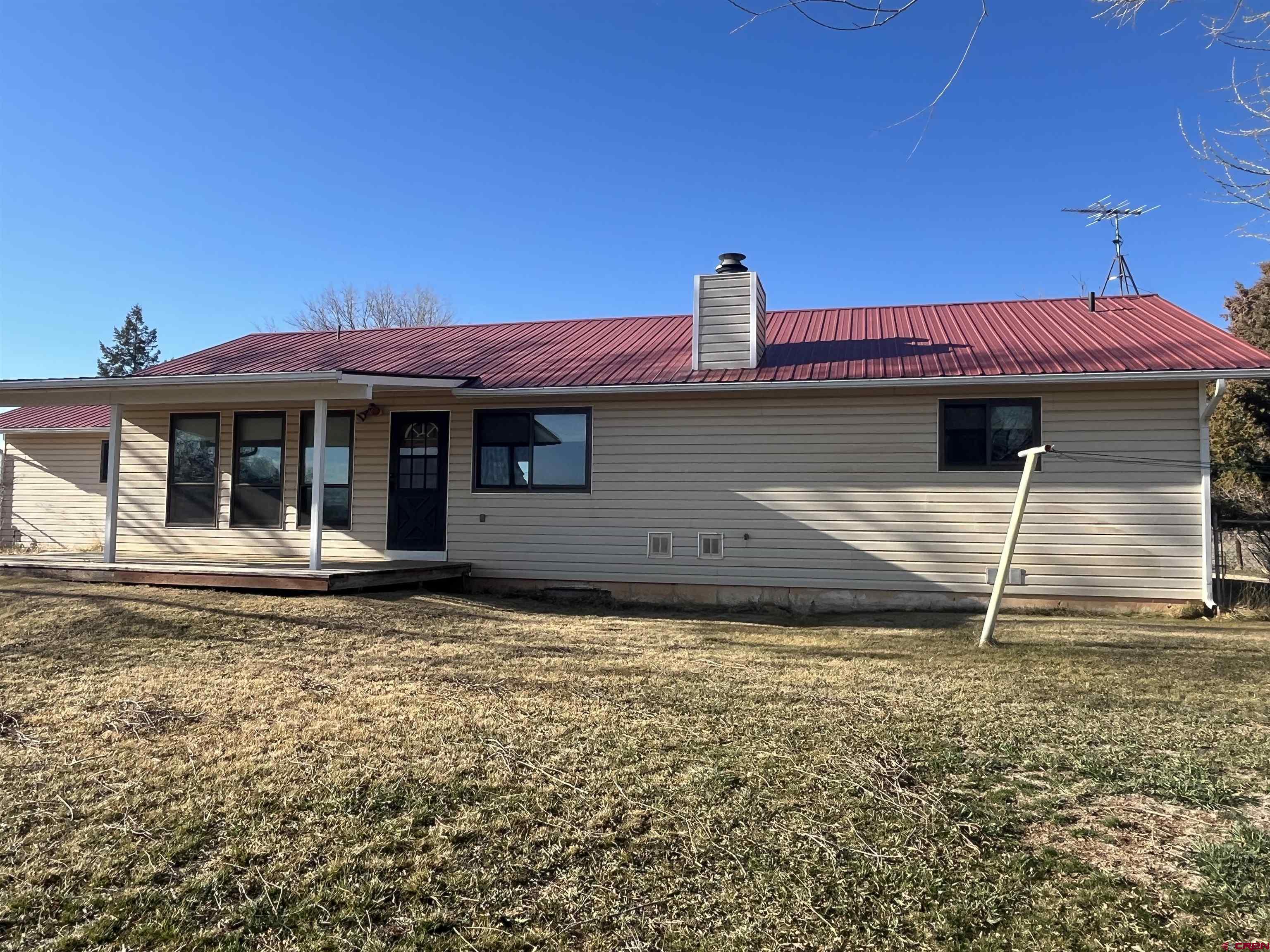 19825 Rd P Cortez, CO 81321 - Photo 29 of 38 a front view of a house with a yard