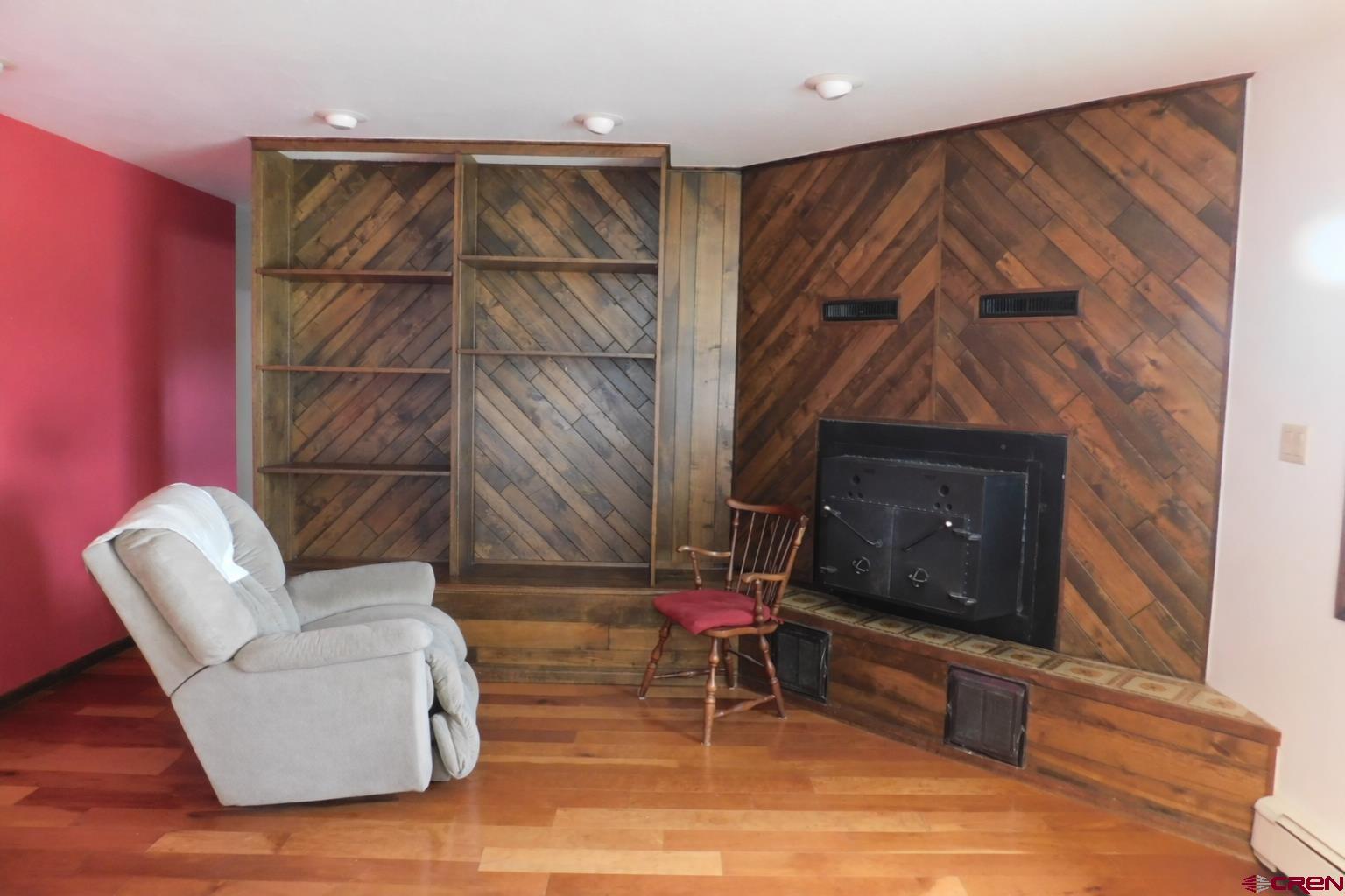 19825 Rd P Cortez, CO 81321 - Photo 3 of 38 a living room with furniture a flat screen tv and a fireplace