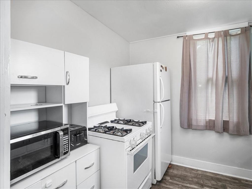 198 Penn Adamsburg Road Penn, PA 15675 - Photo 11 of 27 a kitchen with stainless steel appliances a stove and a refrigerator