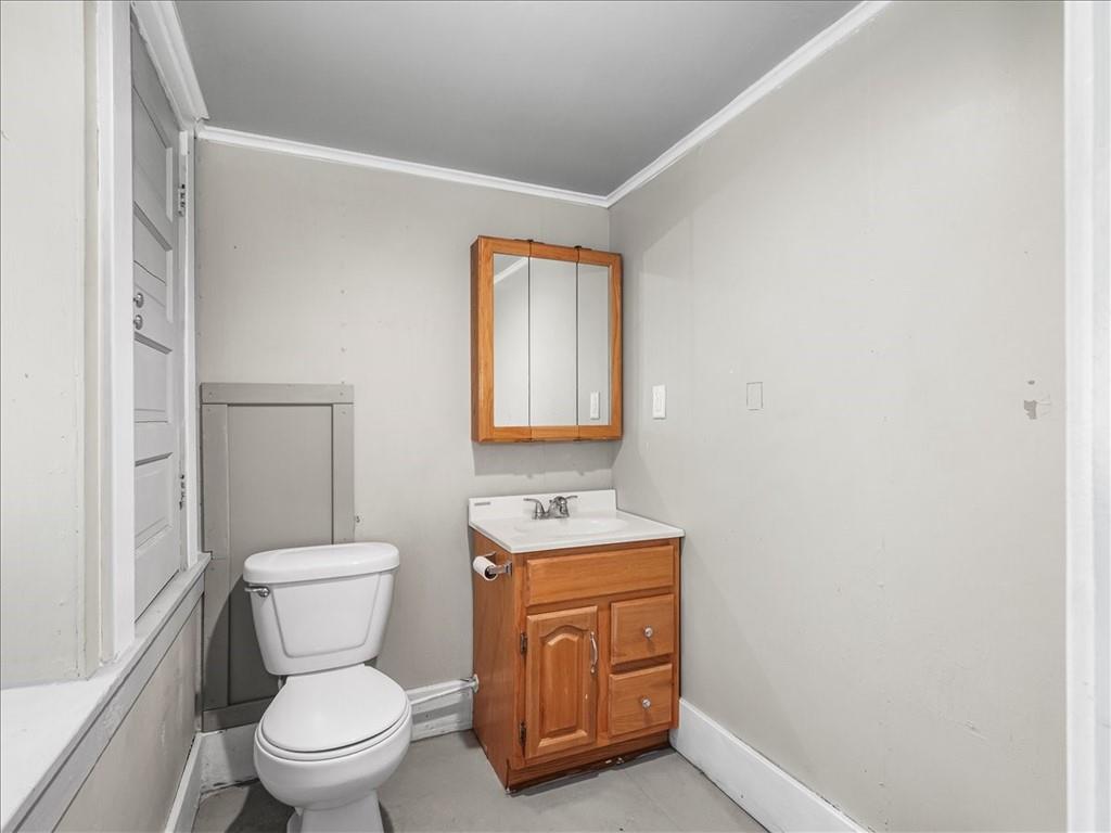 198 Penn Adamsburg Road Penn, PA 15675 - Photo 17 of 27 a bathroom with a toilet sink and mirror