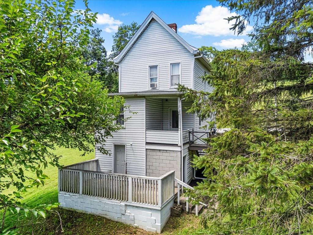 198 Penn Adamsburg Road Penn, PA 15675 - Photo 20 of 27 a view of a house with a small yard and plants